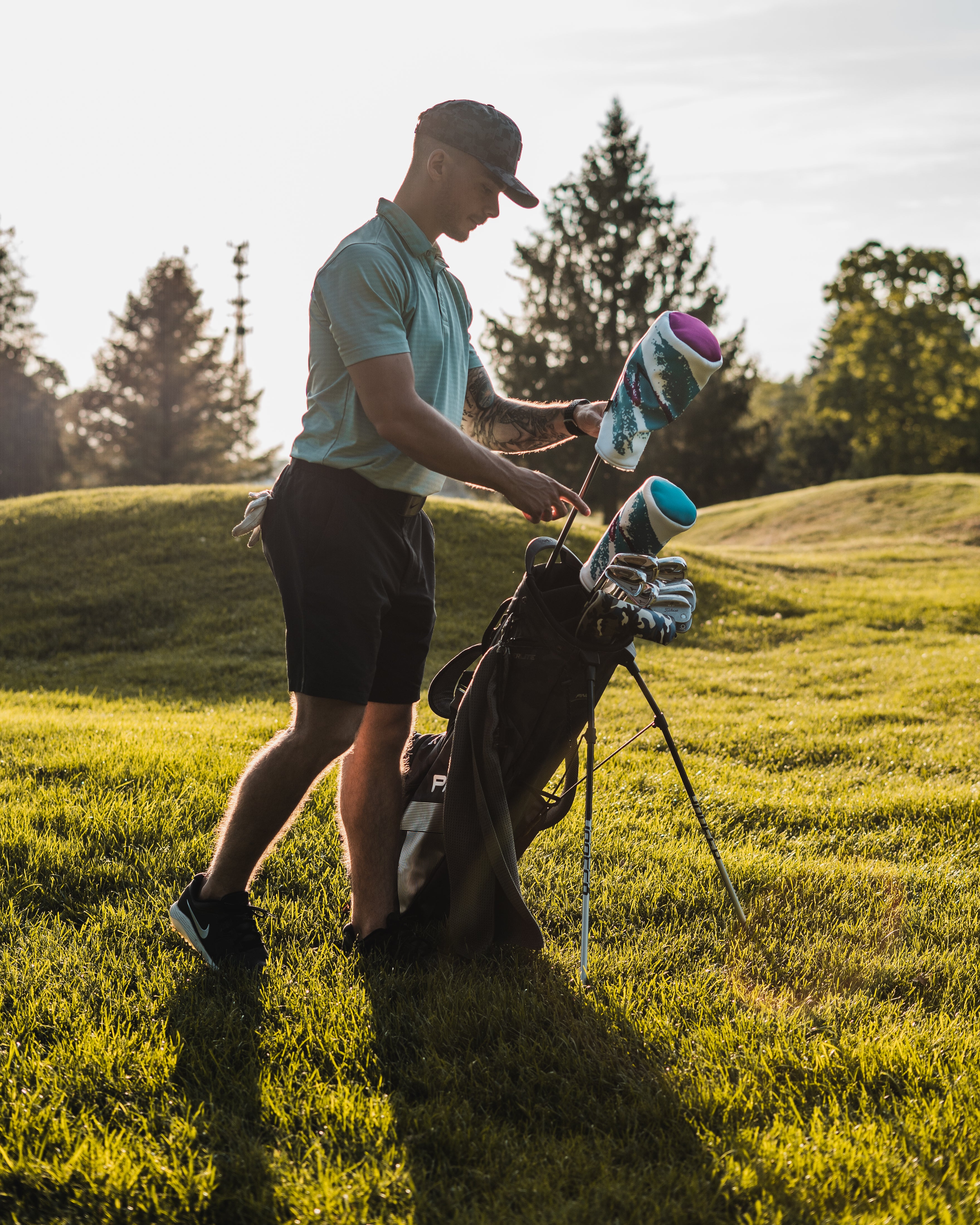 Golfer reaching for his Jazz Cup Driver Head Cover. (2467500195919)