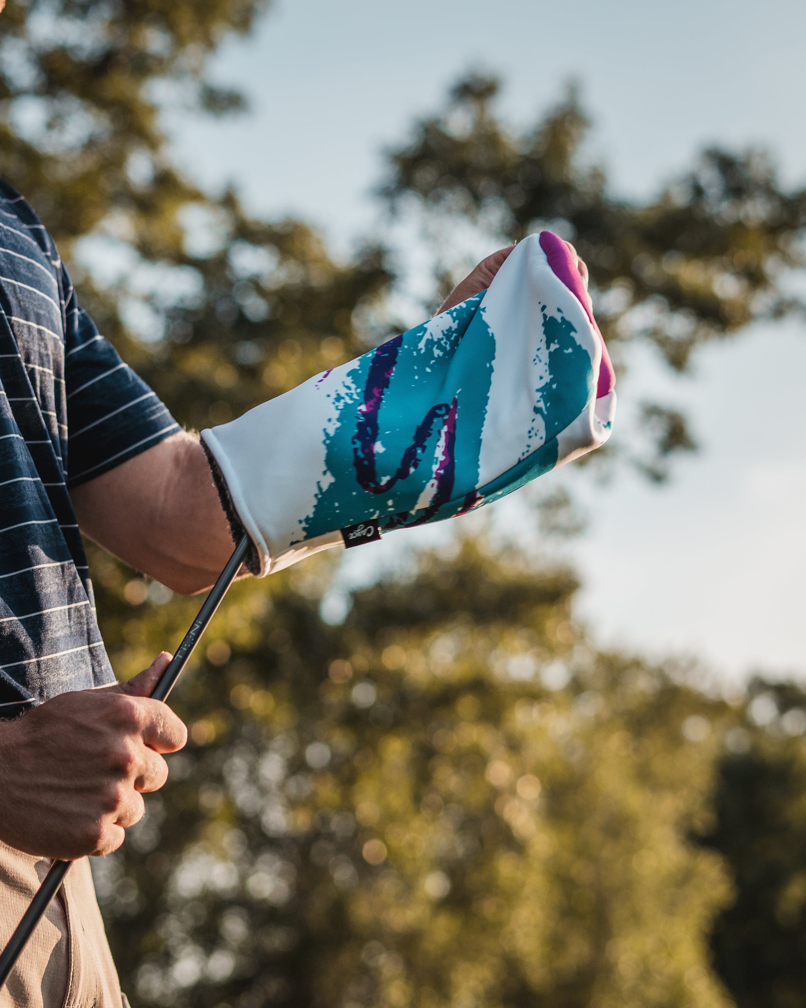 Golfer removing the Jazz Cup Head Cover (2467500195919)