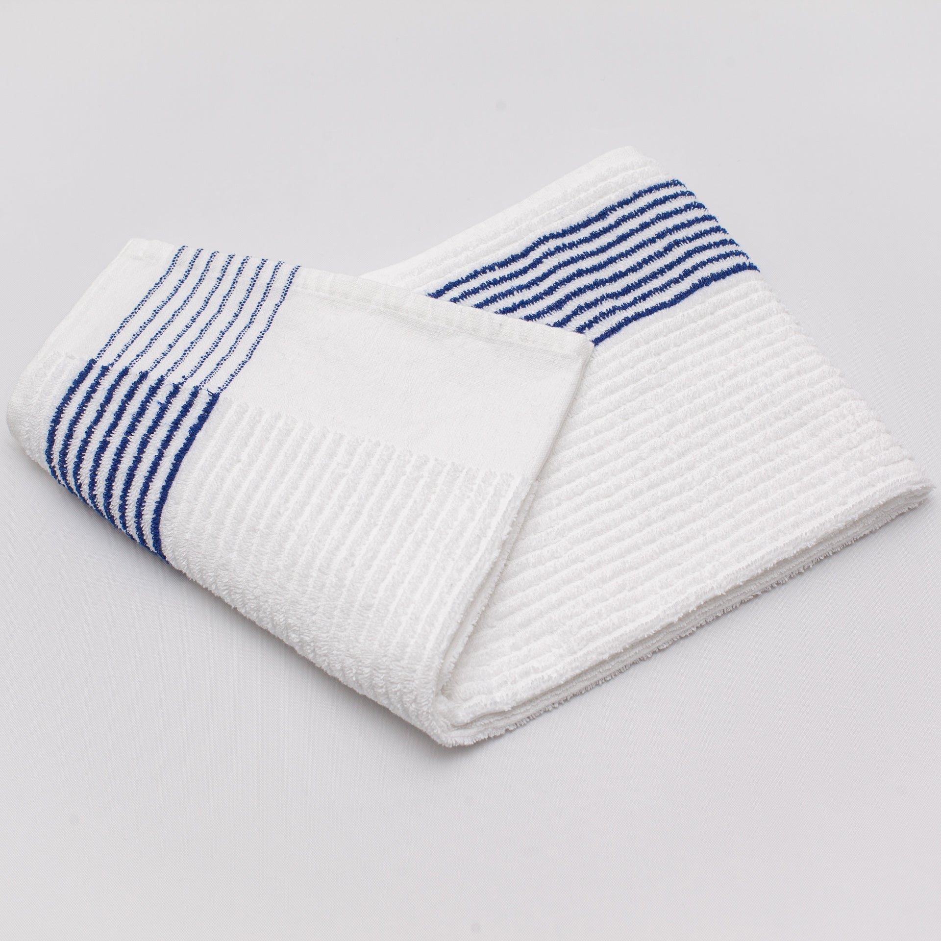 blue striped caddy towel folded on a white background