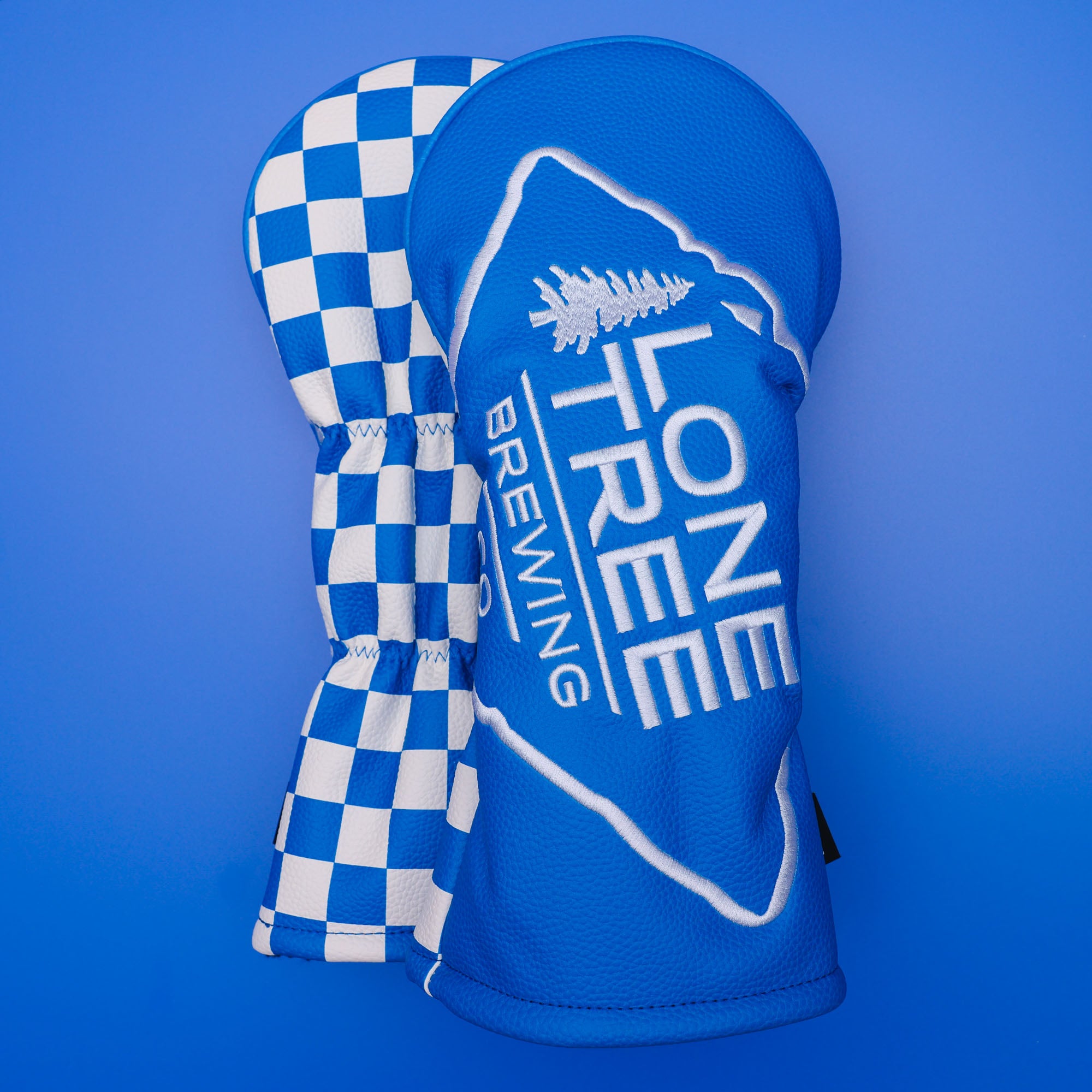 blue custom driver headcovers with embroidered logo and printed pattern from cayce golf 2025