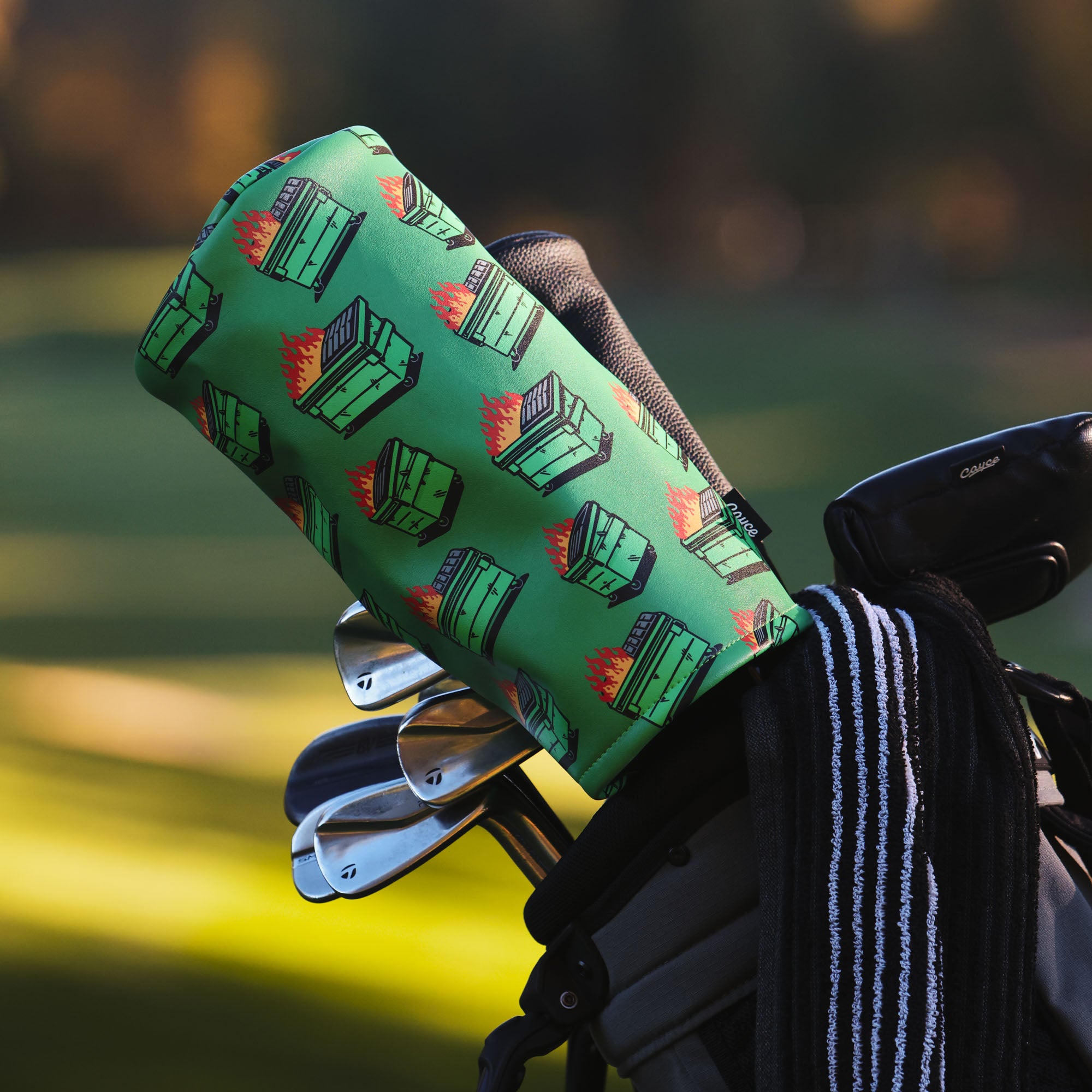 green dumpster fire golf head cover in golf bag from cayce golf
