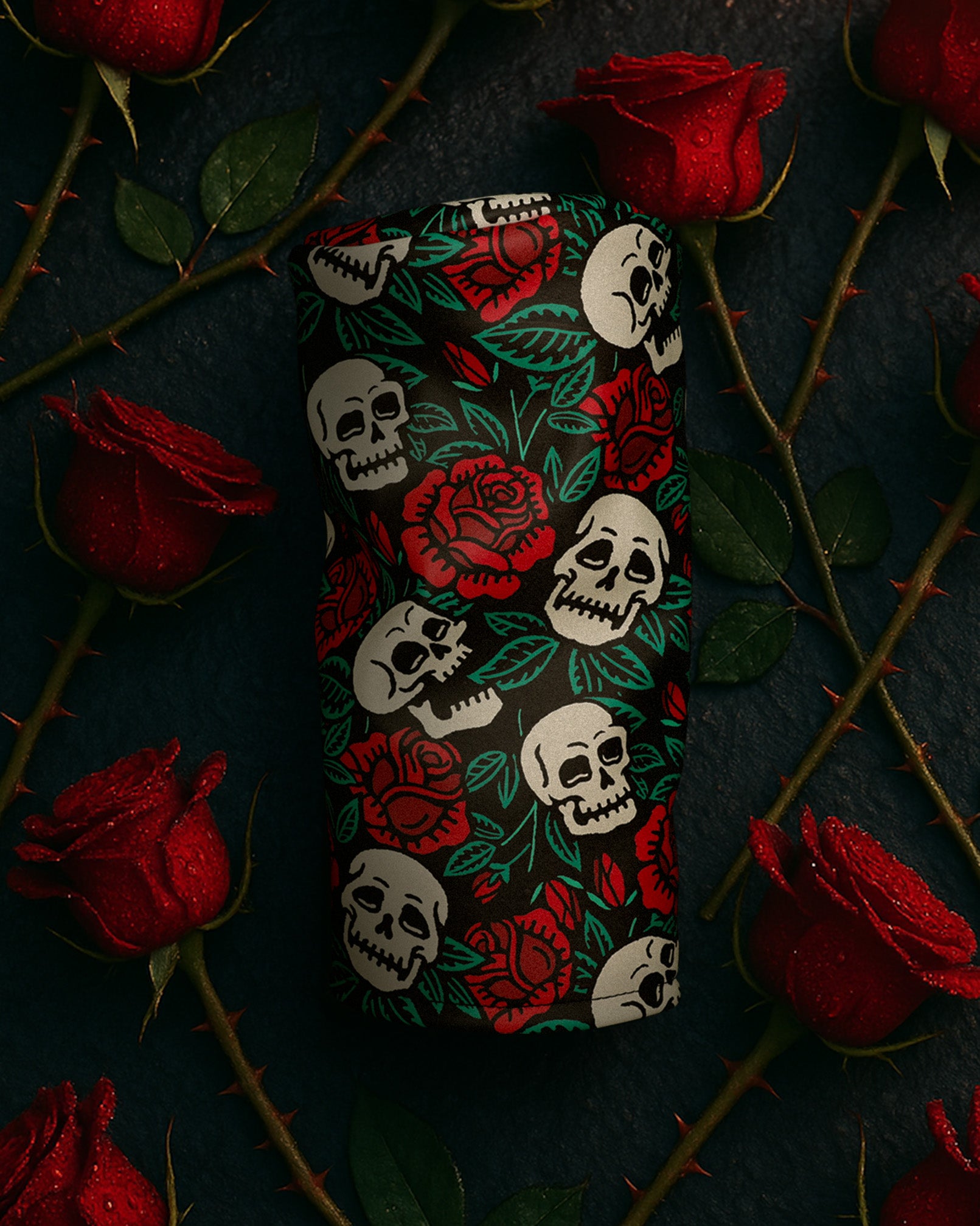 Rose and Skull driver head cover by Cayce Golf sitting on the street surrounded by roses 