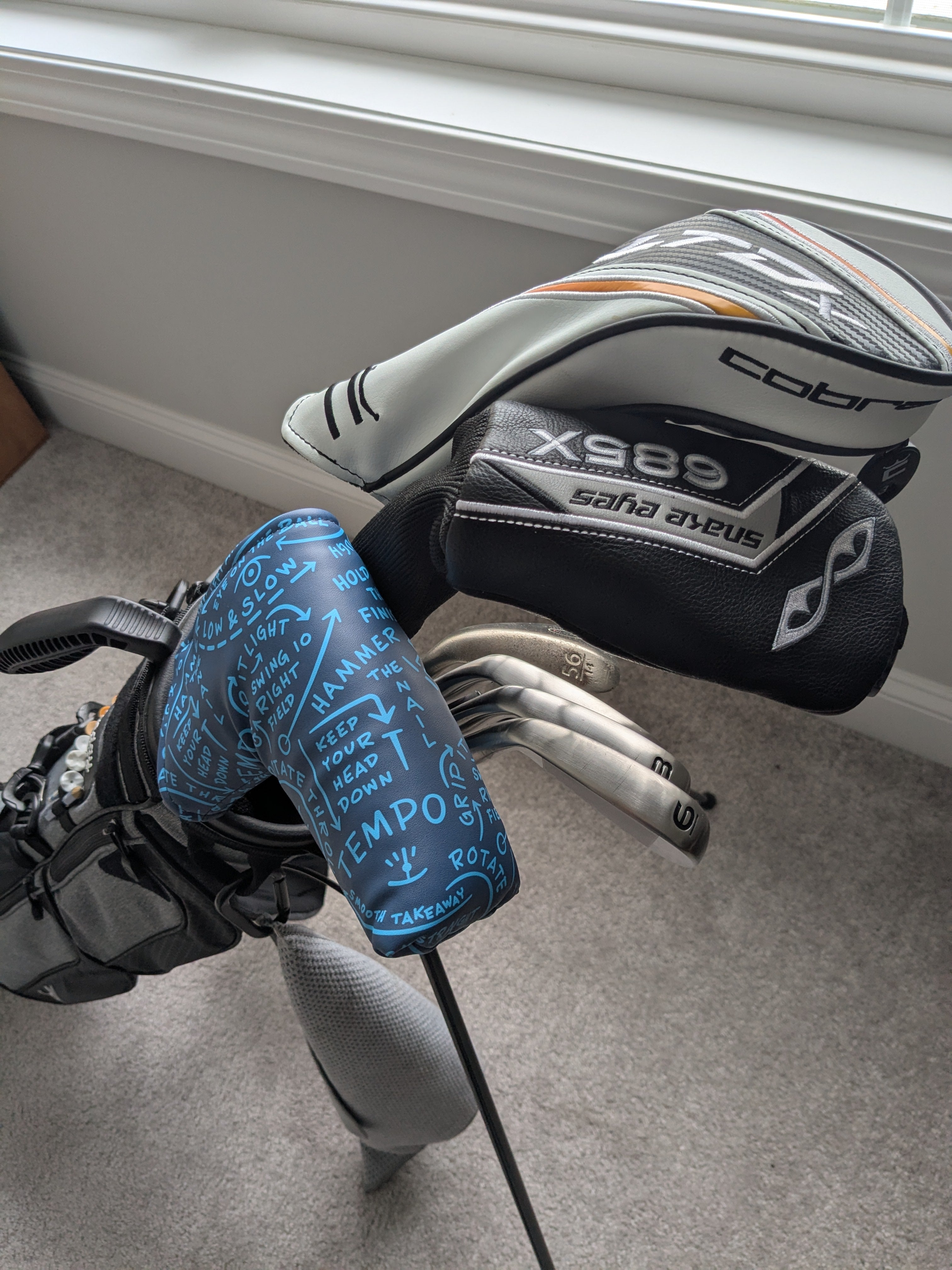 blade putter cover from cayce golf in a golf bag. 