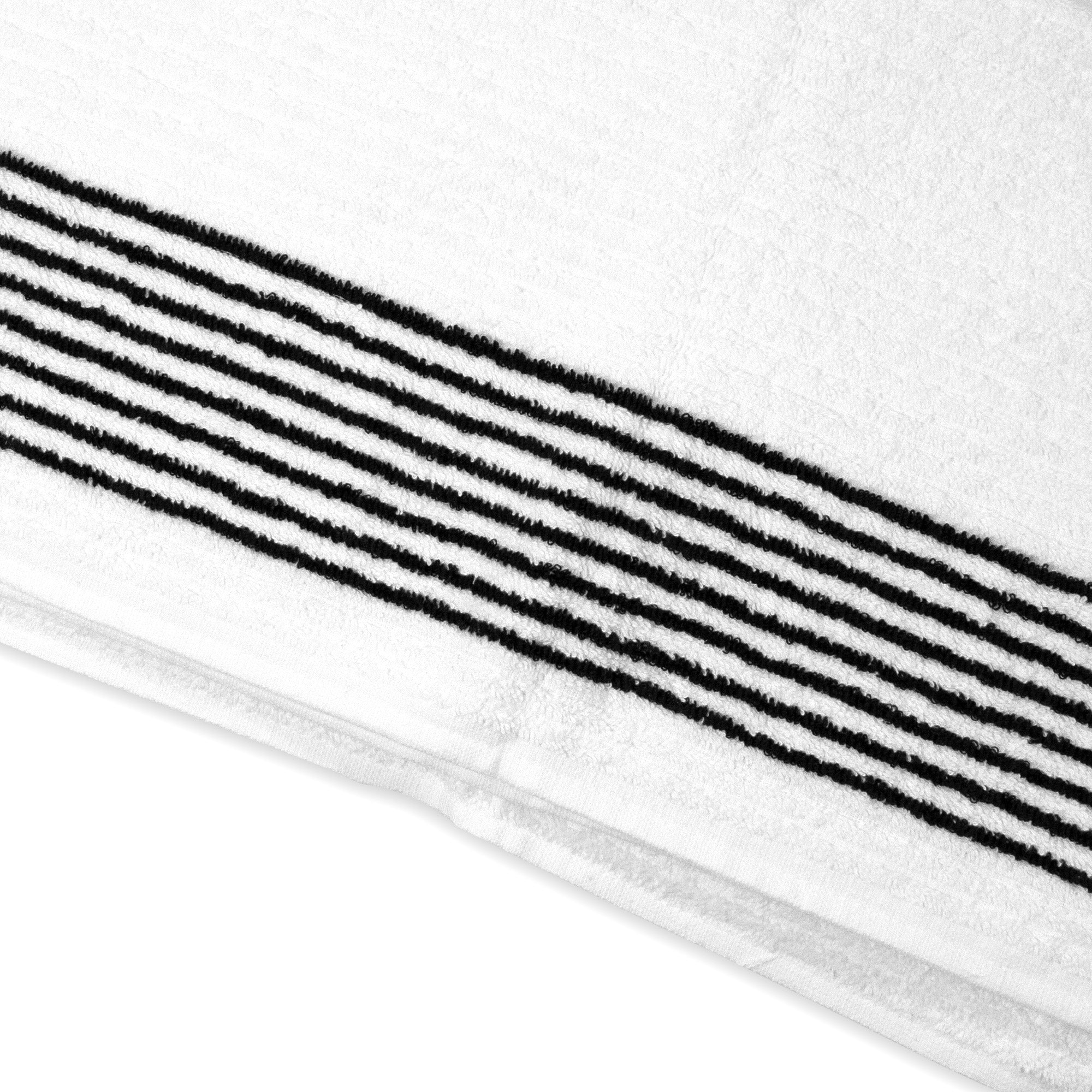 Close up view of the white Caddy Towel with black stripes by Cayce